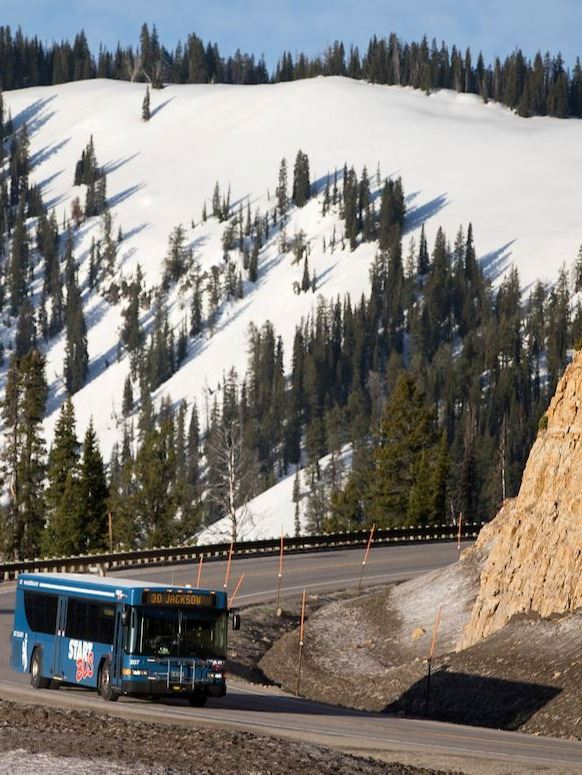 START BUS coming down Teton Pass BIG VIEW