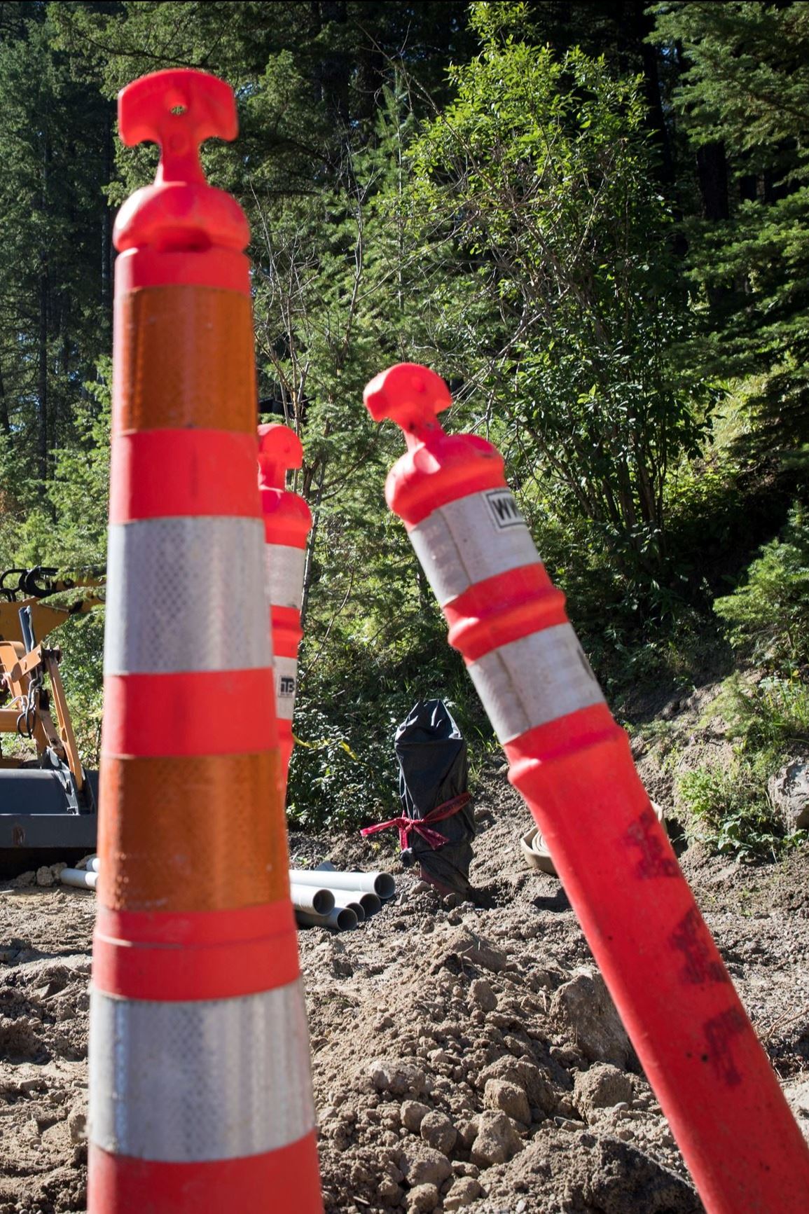 Construction cones and road closed sign